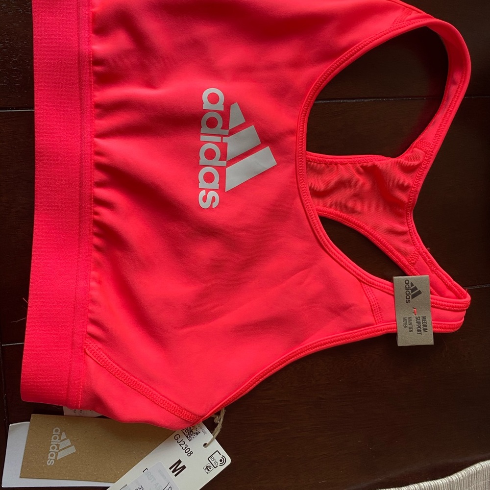 Women’s hot pink Adidas sports bra